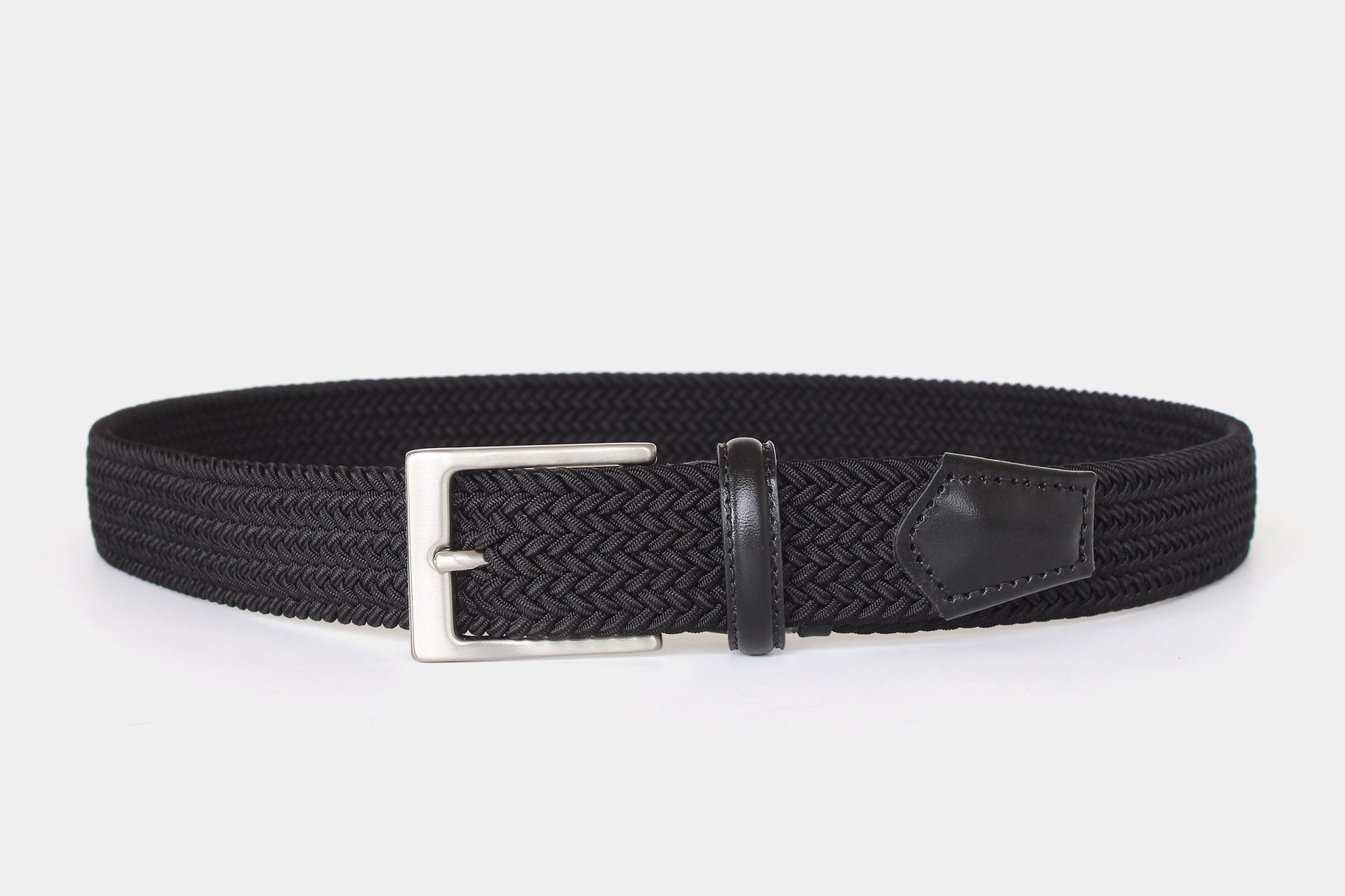 Men’s black slim elastic woven belt with silver solid brass buckle. Handmade in Italy. Flexible for all day comfort.