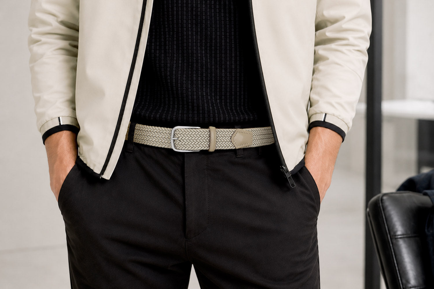 Men's stone woven elastic belt styled with cream jacket and black trousers