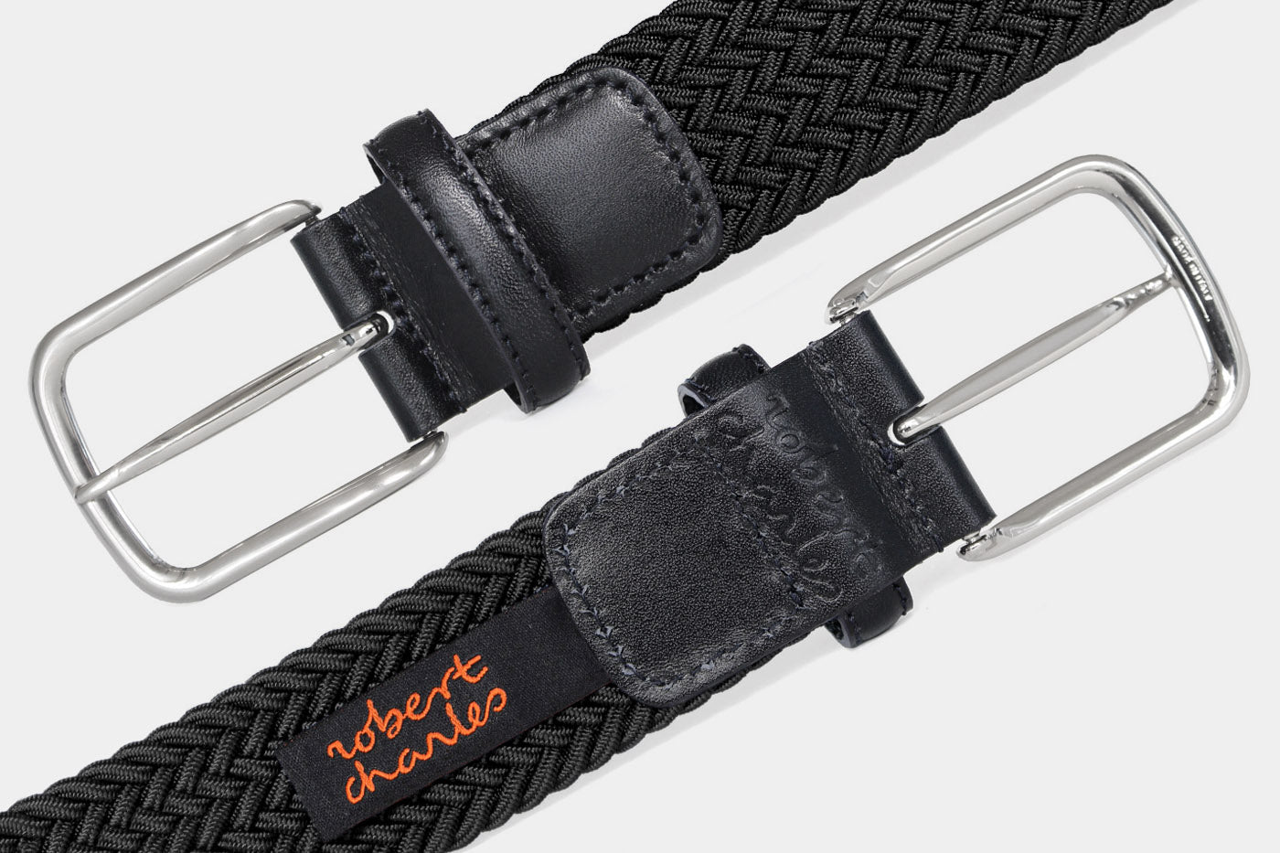 Men’s black elastic woven belt with silver buckle. Handmade in Italy with genuine Italian leather detail.