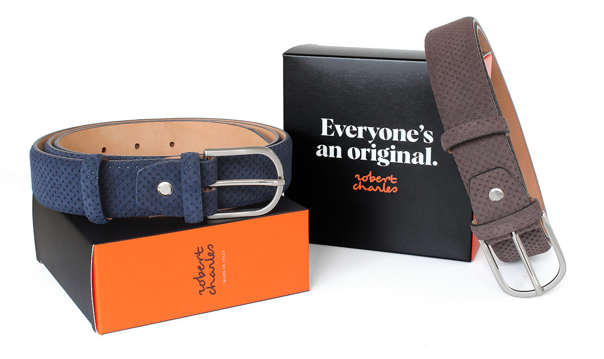 Handmade perforated suede Italian leather belts with solid brass buckle, displayed with Robert Charles gift box