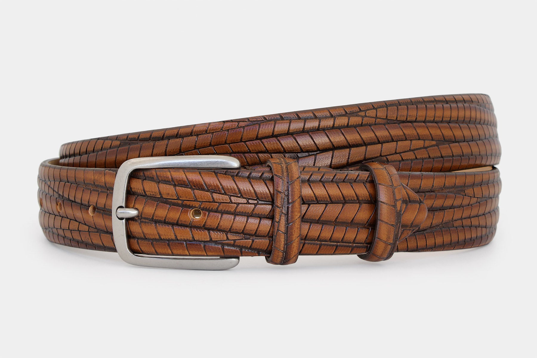Men's tan embossed genuine leather belt handmade in Italy with silver buckle, angled product view