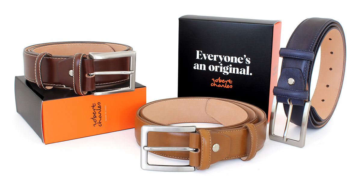 Handmade hand-buffed classic Italian leather belts with solid brass buckle, displayed with Robert Charles gift box