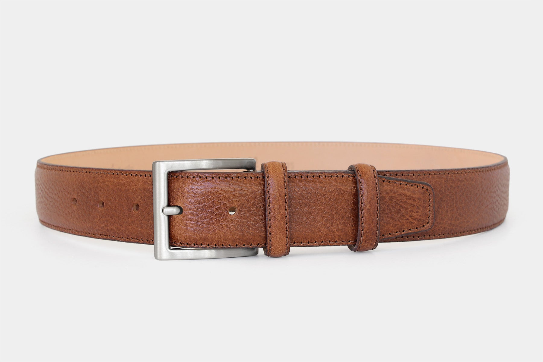 Men’s tan grained Italian leather belt with silver buckle and tone-on-tone stitching. Handmade in Italy.