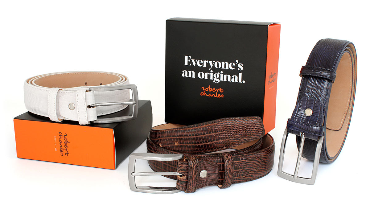 Handmade snake skin Italian leather belts with classic solid brass buckle, displayed with Robert Charles gift box
