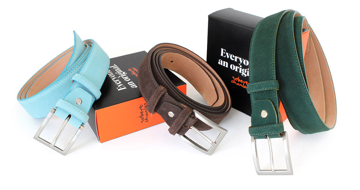 Handmade suede Italian leather belts with solid brass buckle, displayed with Robert Charles gift box