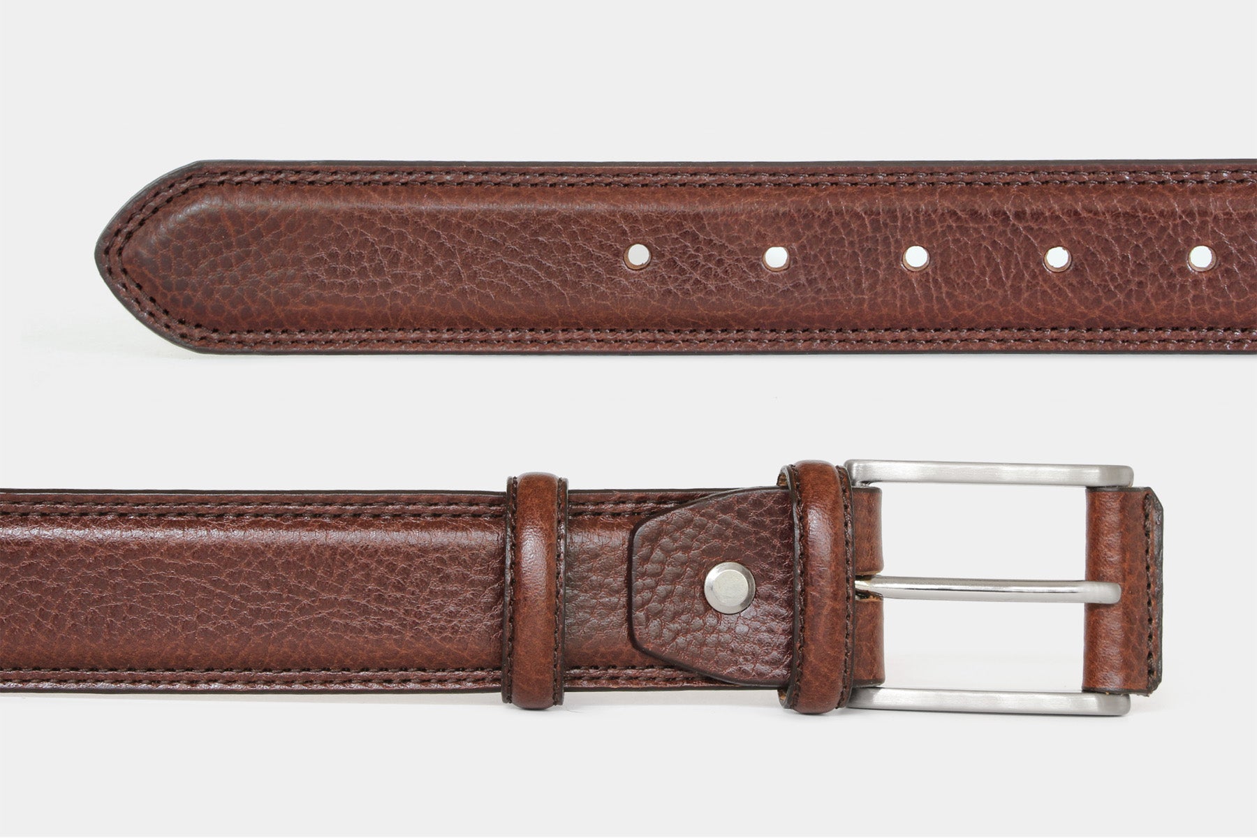 Men’s brown grained Italian leather belt, detail view of double stitching and solid brass buckle with leather cover.