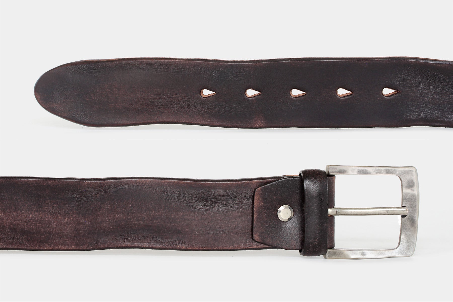 Women’s brown solid hide Italian leather belt, detail view of leather and weathered buckle.