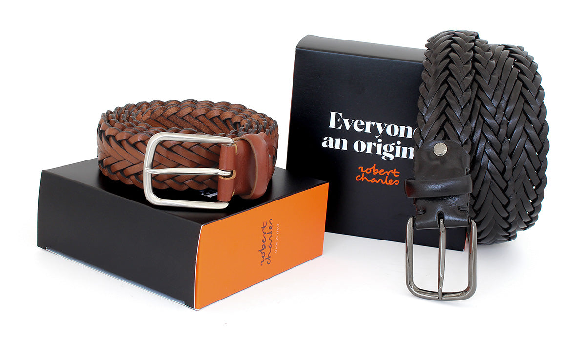 Braided men’s belts handwoven from Italian solid hide with silver buckles displayed with Robert Charles gift box