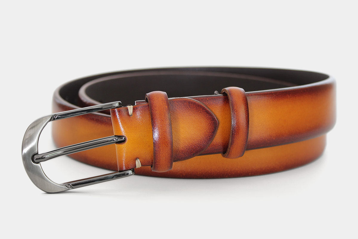 Men's tan handpainted genuine leather belt handmade in Italy with polished gunmetal buckle, showing stitching detail
