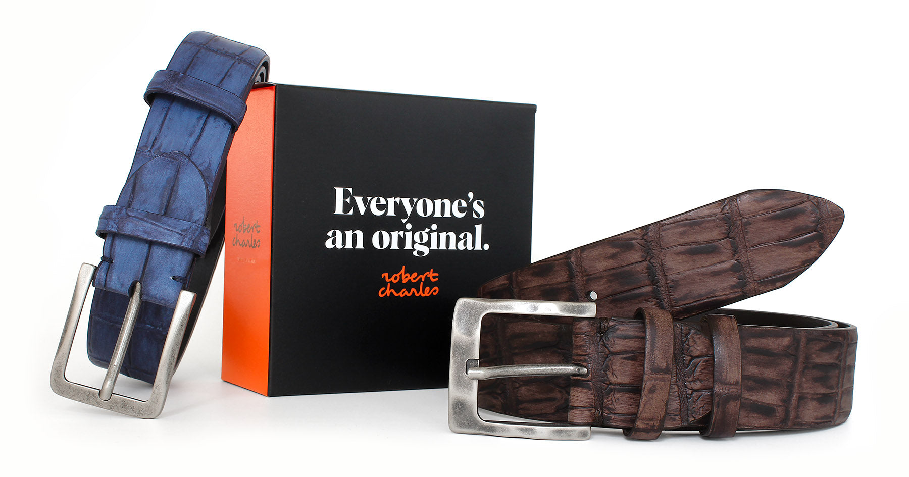 Hand-painted crocodile Italian leather belts with weathered buckle, displayed with Robert Charles gift box