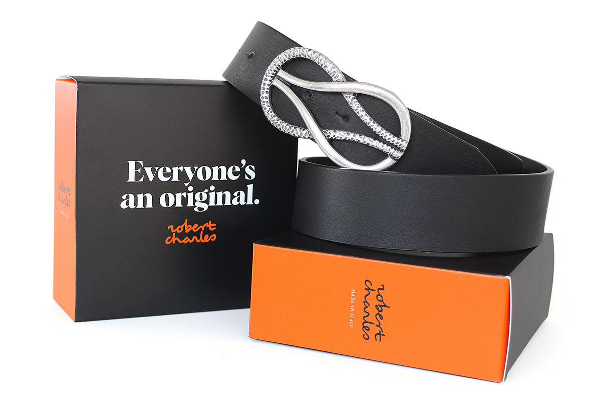 Handmade solid hide Italian leather belts with sculptural plate buckle, displayed with Robert Charles gift box