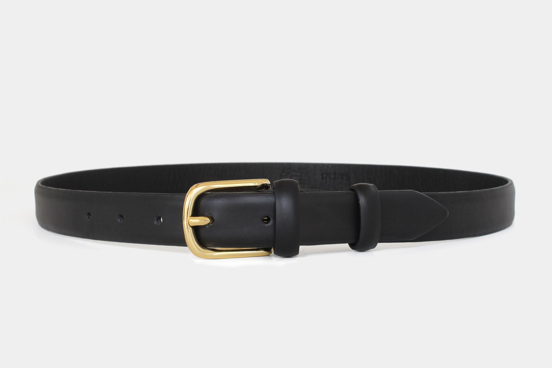 Women’s black slim Italian calfskin leather belt with classic gold buckle in feather edge finish. Made in Italy.