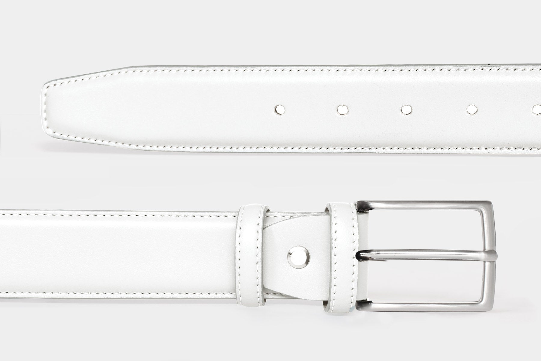 Close-up of men's white soft Italian calfskin leather belt with a classic solid brass buckle. Handmade in Italy.