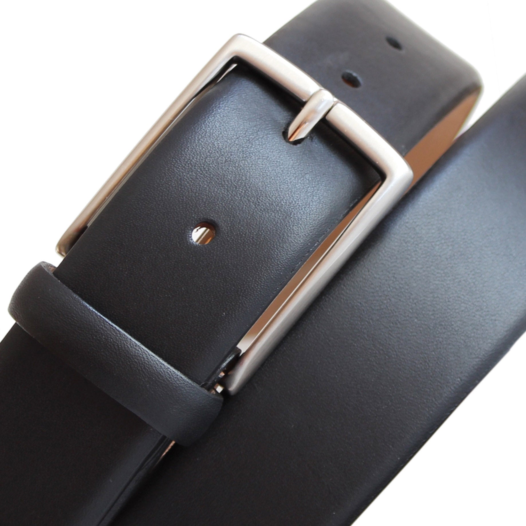 Close-up of a black calfskin Italian leather belt with a classic solid brass buckle and feather edge finish.