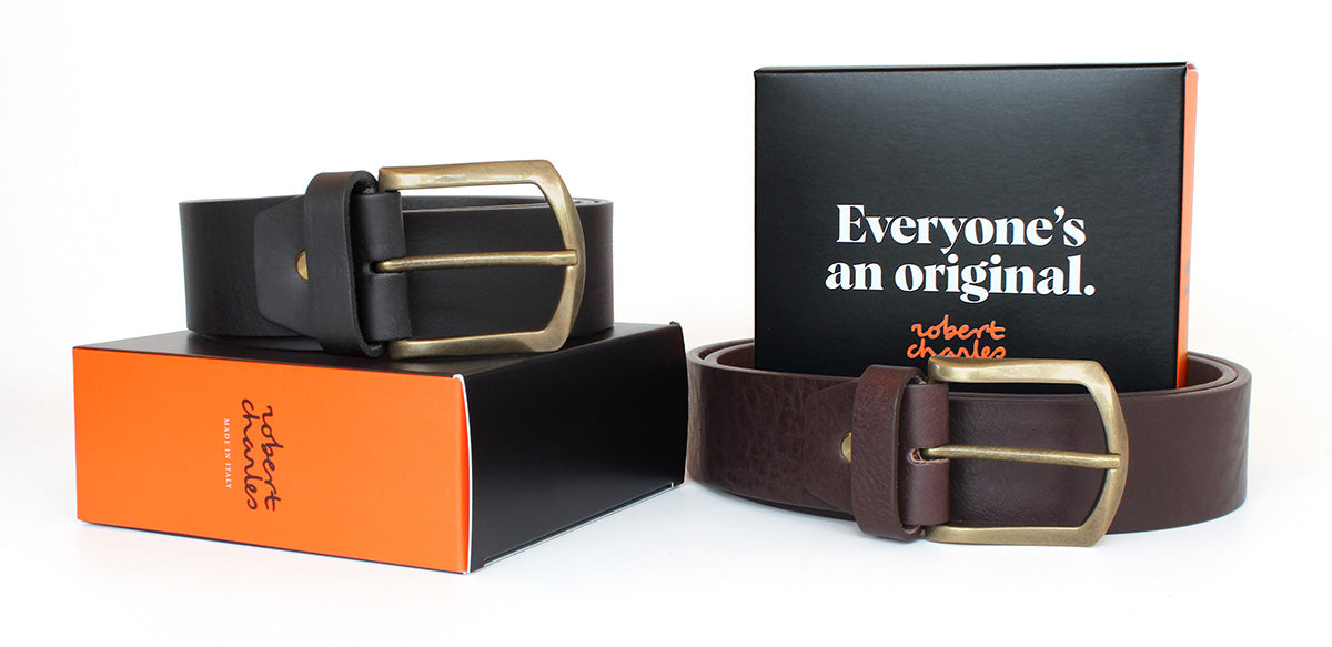 Handmade solid hide Italian leather jeans belts with gold brass buckle, displayed with Robert Charles gift box