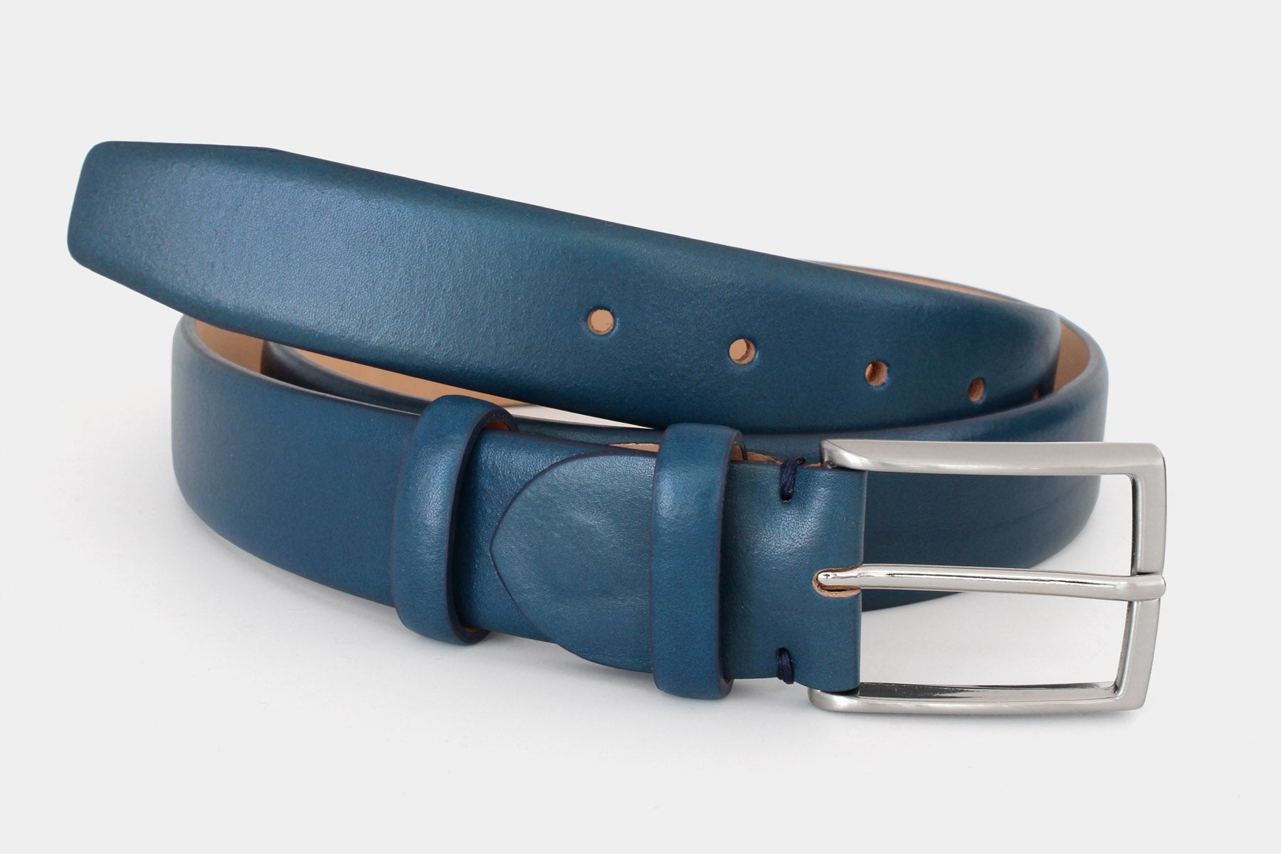 Men’s blue Italian leather belt with classic solid brass buckle and feather edge finish. Handmade in Italy.