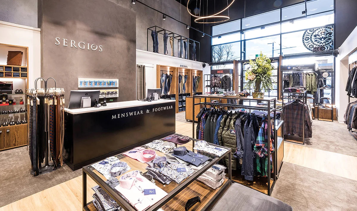 Robert Charles belts displayed in a premium menswear store