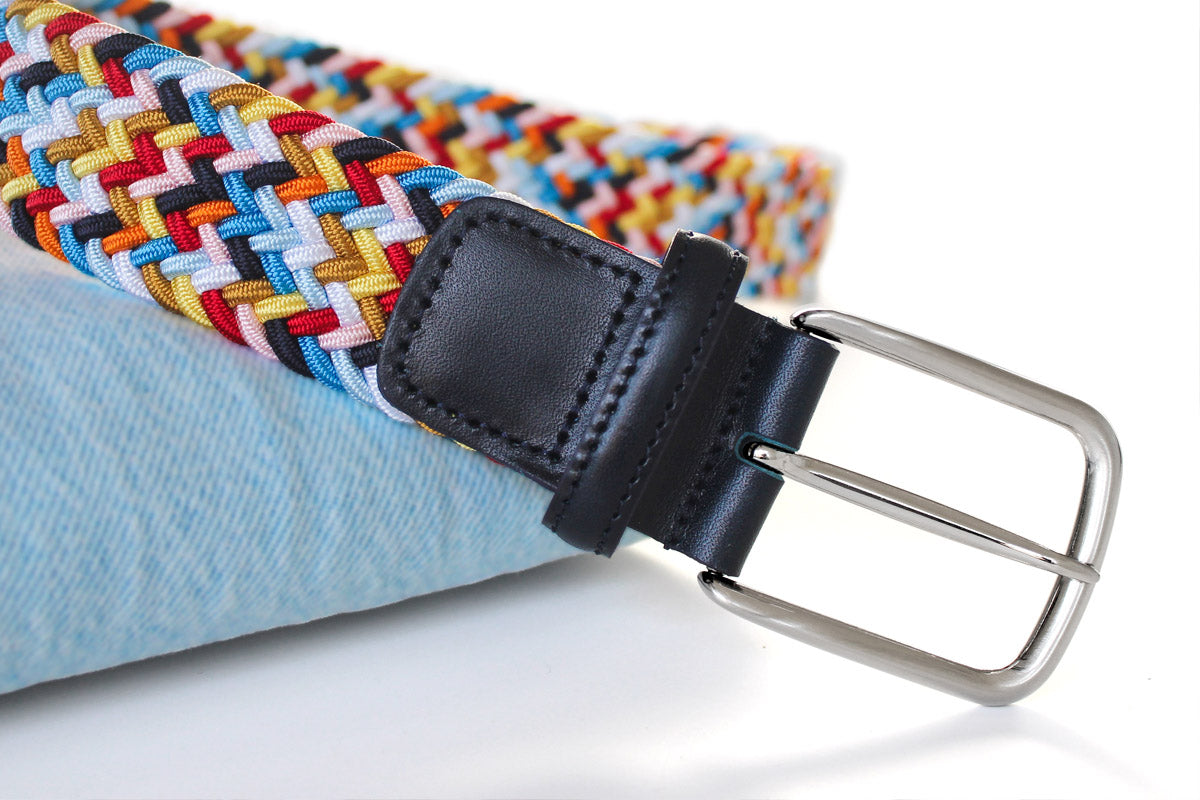 Silver sold brass buckle detail with a colourful elastic belt and navy vegetable tanned leather accent. Made in Italy.