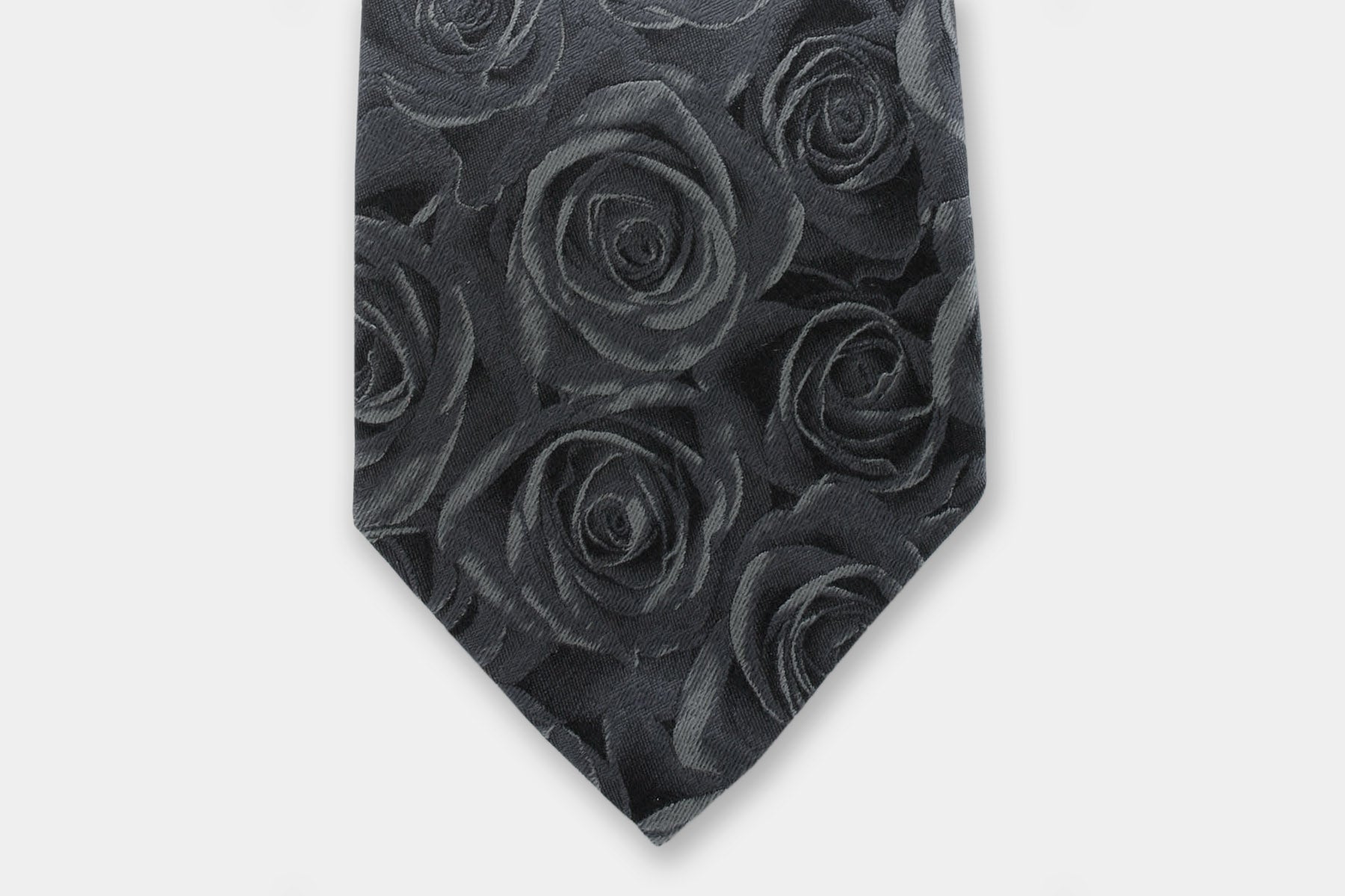 Close-up of a Robert Charles rose grey silk tie highlighting the fine Italian craftsmanship and intricate weave.
