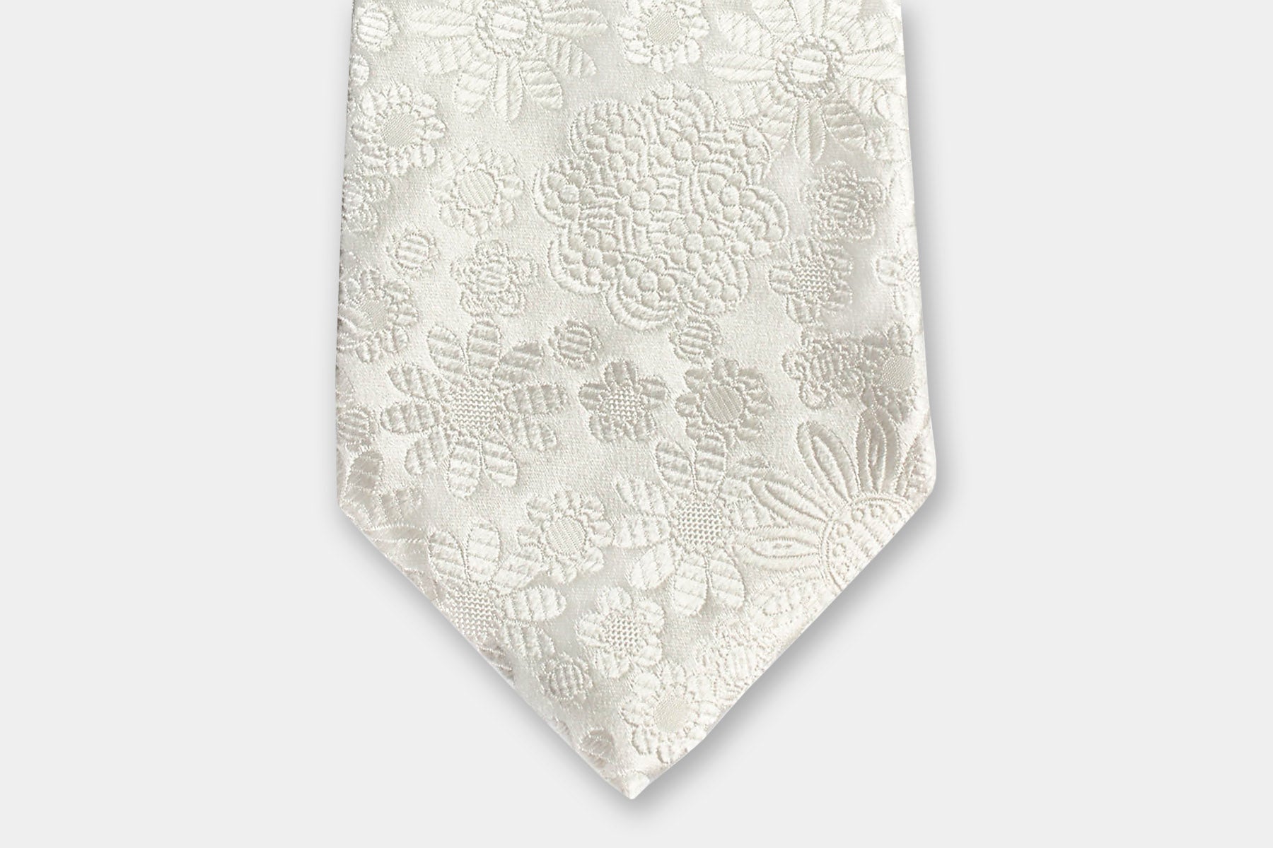 Close-up of a Robert Charles ivory silk tie with an intricate jacquard floral weave perfectly suited for weddings.