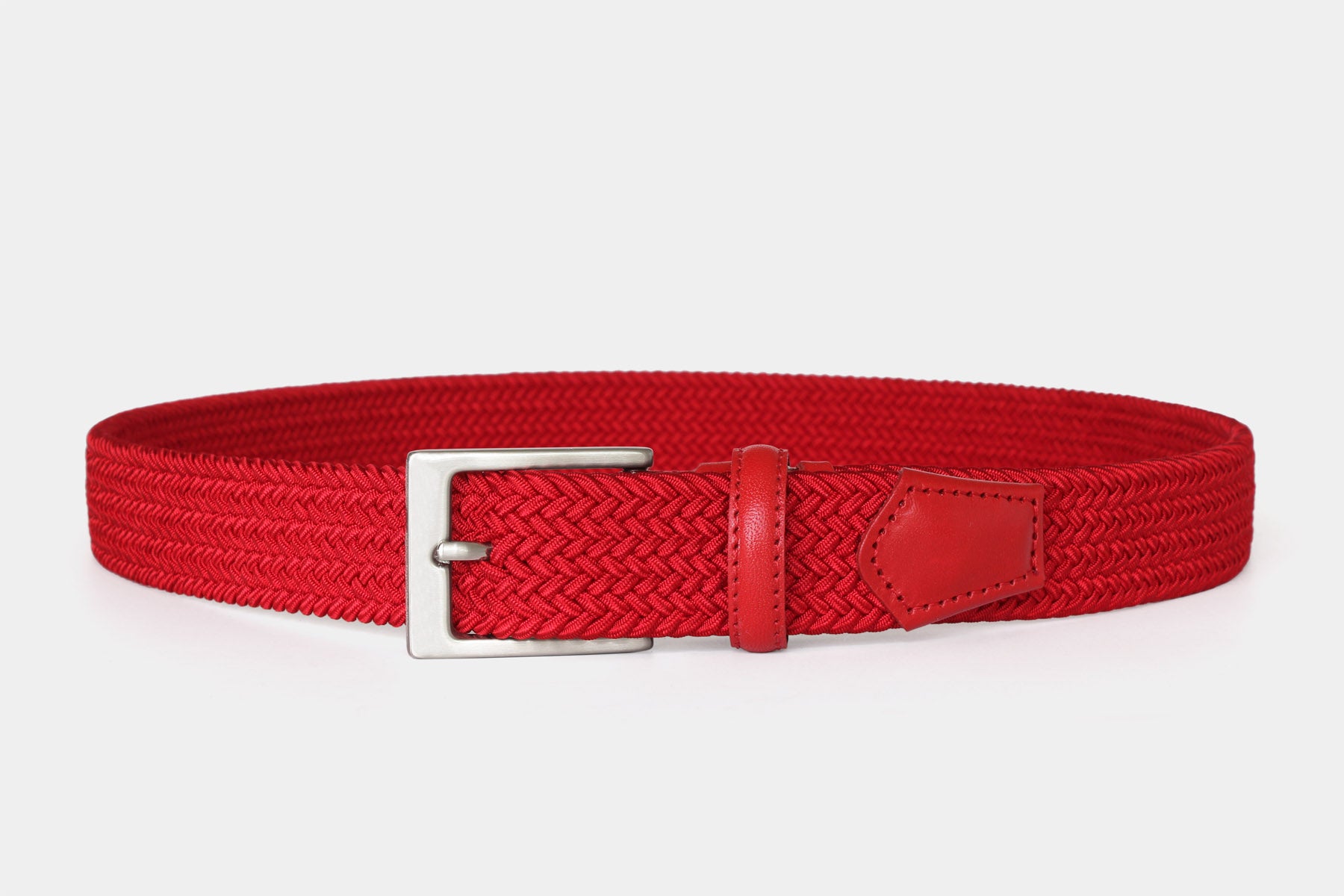 Men’s red slim elastic woven belt with silver solid brass buckle. Handmade in Italy. Flexible for all day comfort.