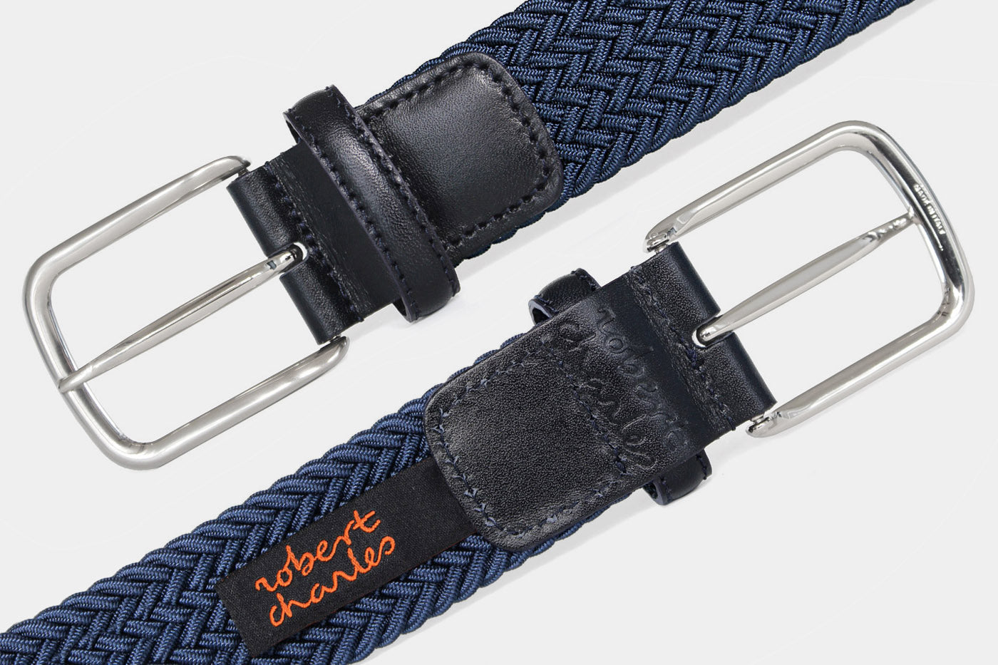 Men’s blue elastic woven belt with silver buckle. Handmade in Italy with genuine Italian leather detail.