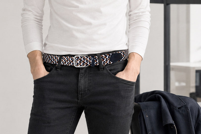 Men's woven elastic belt styled with black jeans for smart casual wear