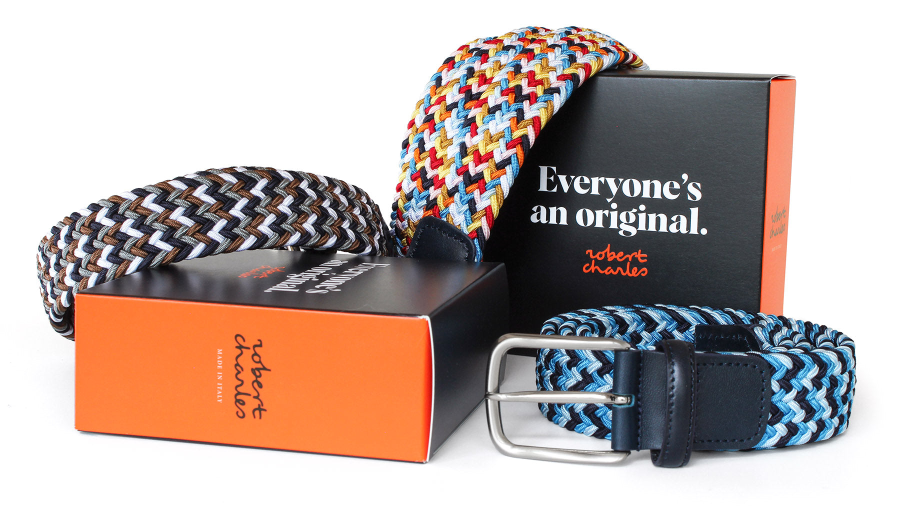 Handcrafted multicolour elastic belts with silver buckle, displayed with Robert Charles gift box. Handmade in Italy.