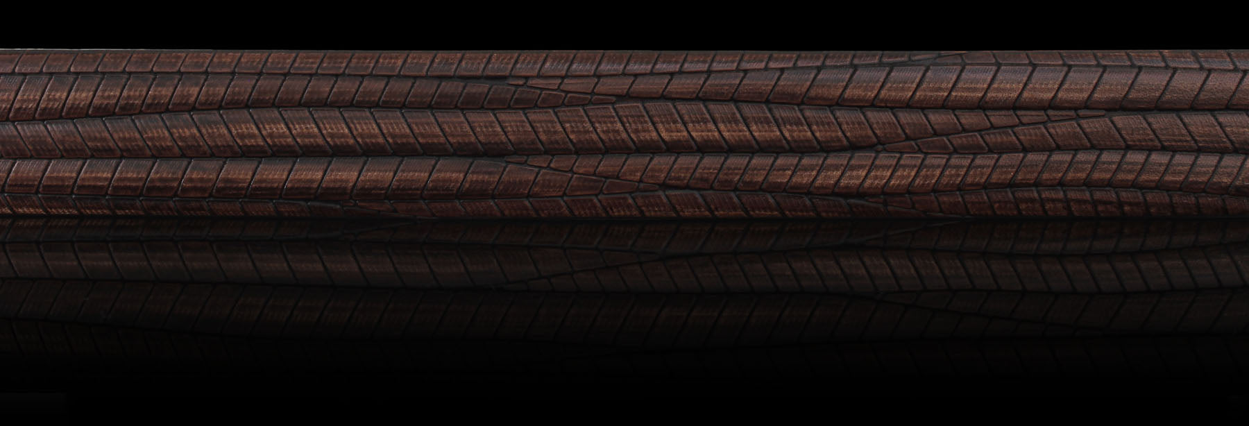 Brown embossed geometric pattern genuine leather belt stripe on black background