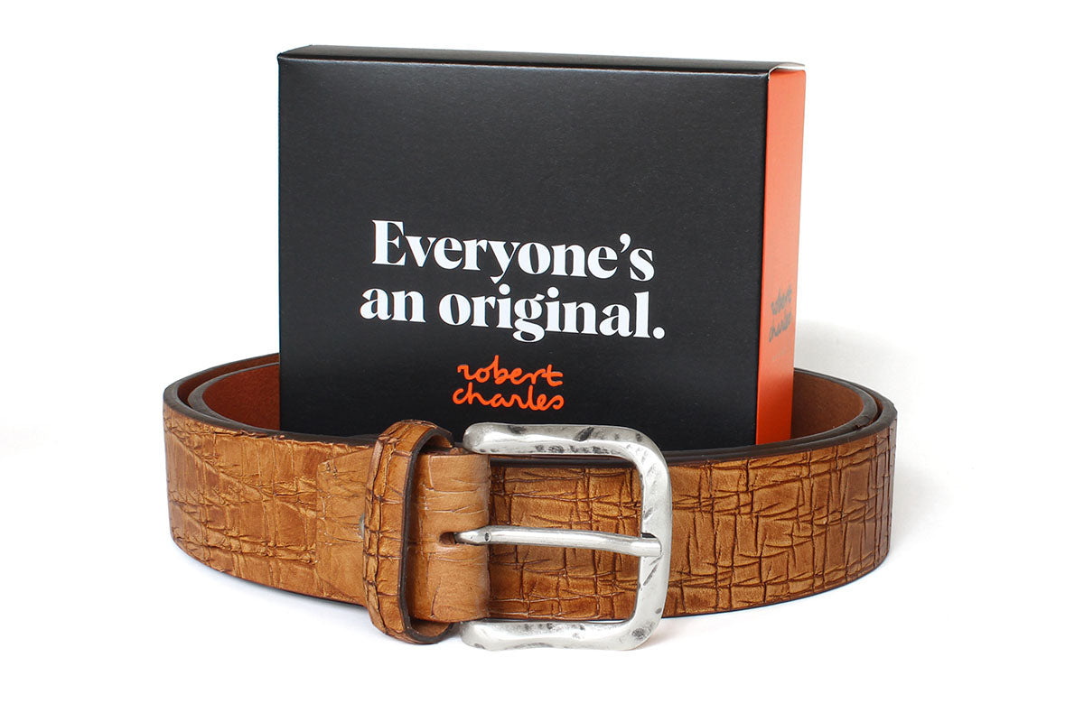 Handmade tan Italian solid hide leather belt with silver buckle, displayed with Robert Charles gift box 