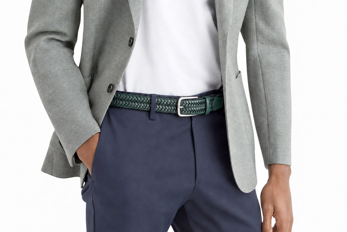 Men’s dark green woven elastic leather belt styled with a light grey blazer, white shirt and navy trousers.