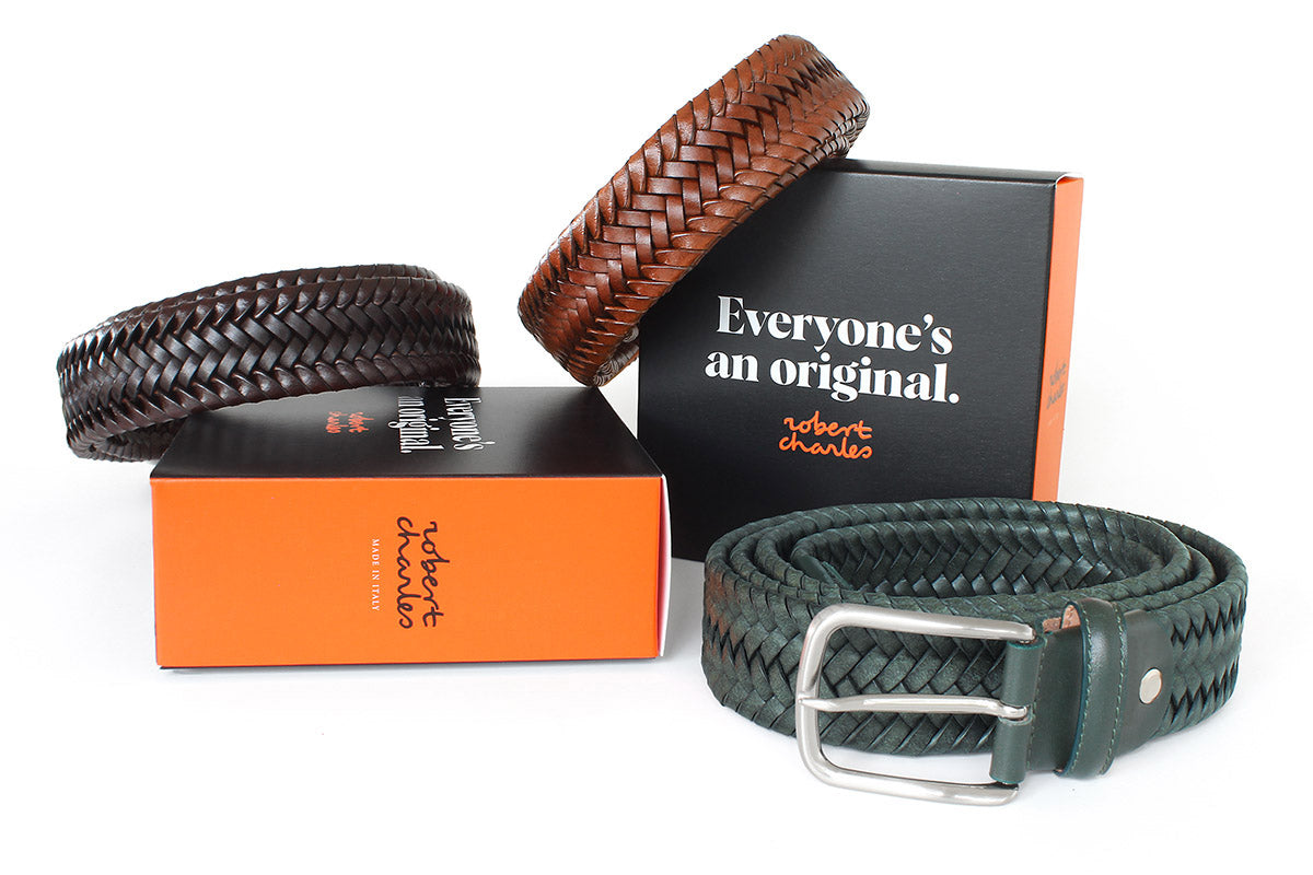 Handmade braided Italian leather belts with silver buckle, displayed with Robert Charles gift box 