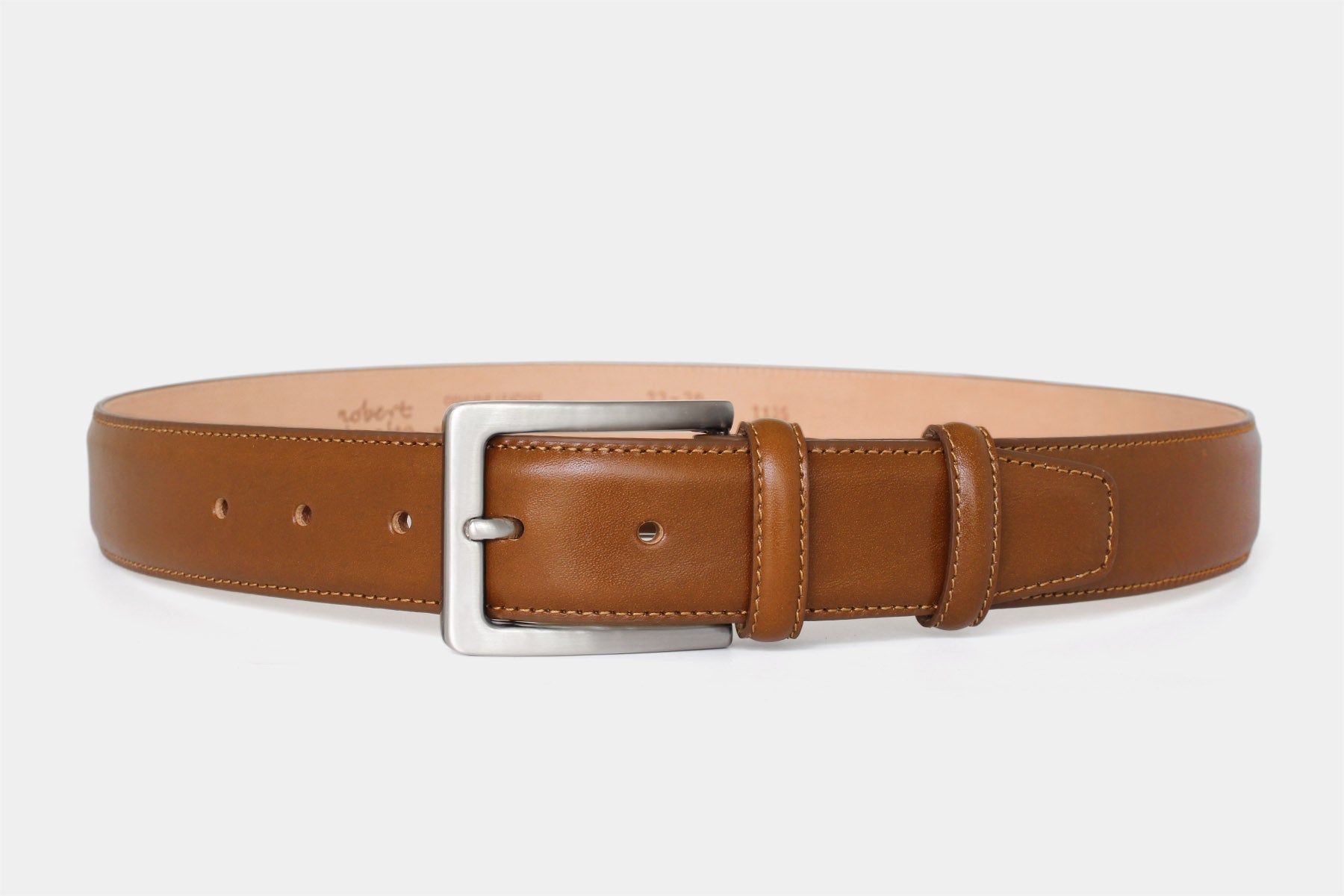 Men’s tan genuine Italian leather belt handmade in Italy with silver buckle and stitched edge.