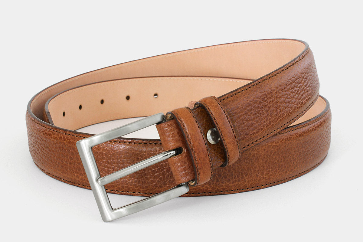 Men’s tan grained Italian leather belt, handmade in Italy with silver buckle and tone-on-tone stitching. 