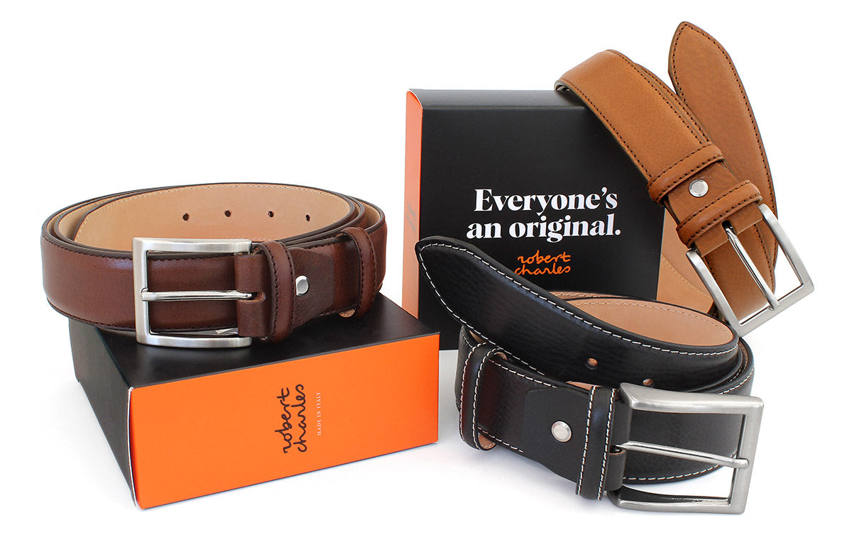 Handmade grained Italian leather belts with solid brass buckle, displayed with Robert Charles gift box 