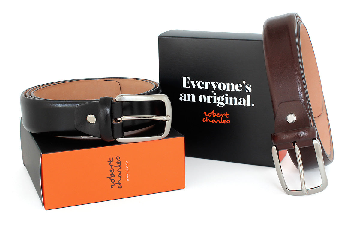 Handmade smooth Italian leather belts with silver buckle, displayed with Robert Charles gift box 