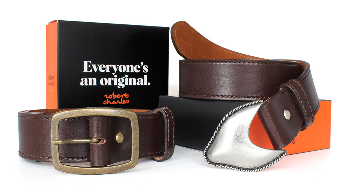 Handmade Italian leather jeans belts with Western-style buckles, displayed with Robert Charles gift box 