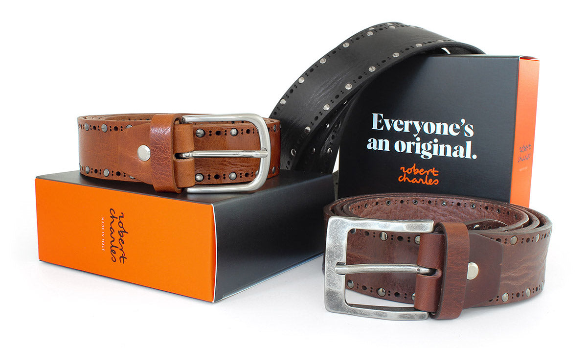 Handmade solid hide studded Italian leather jeans belts with weathered buckle, displayed with Robert Charles gift box 