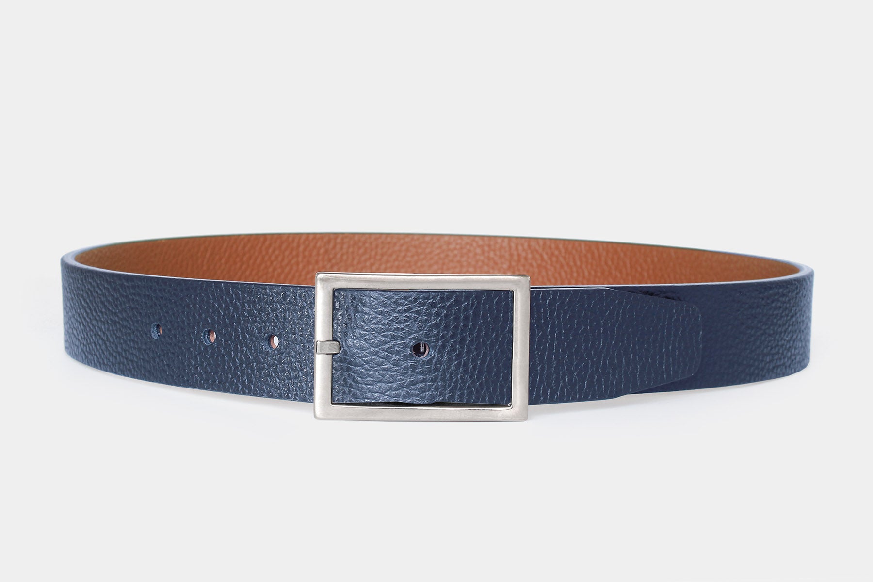 Men’s reversible navy and tan leather belt, slim 30mm width. Handmade in Italy from genuine leather with silver buckle.