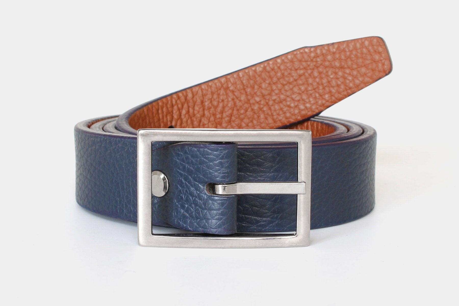Reversible slim men’s belt in navy and tan genuine leather. Handmade in Italy with a silver buckle.