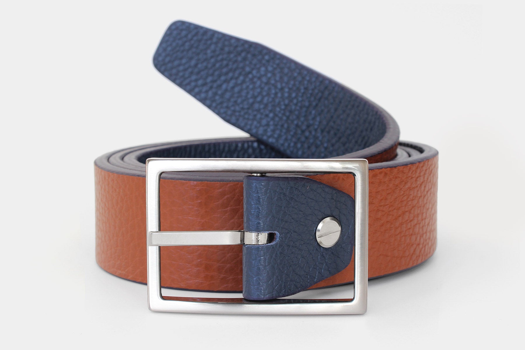 Reversible men’s belt in navy and tan genuine leather. Handmade in Italy with a silver buckle.