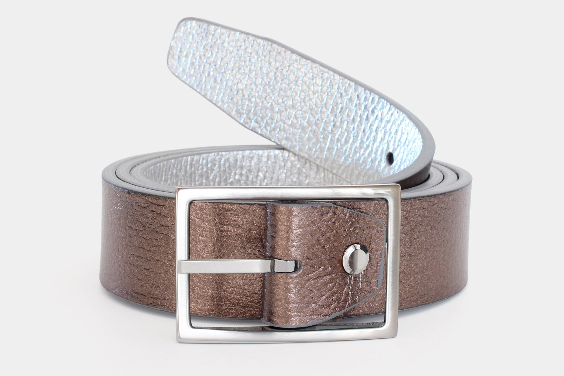 Women's reversible soft Italian grained leather belt with a feather edge finish in metalic bronze and silver. Made in Italy.