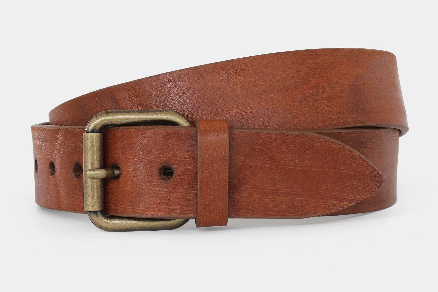 Men’s tan distressed solid hide Italian leather jeans belt with brass roller buckle. Raw cut and vegetable tanned