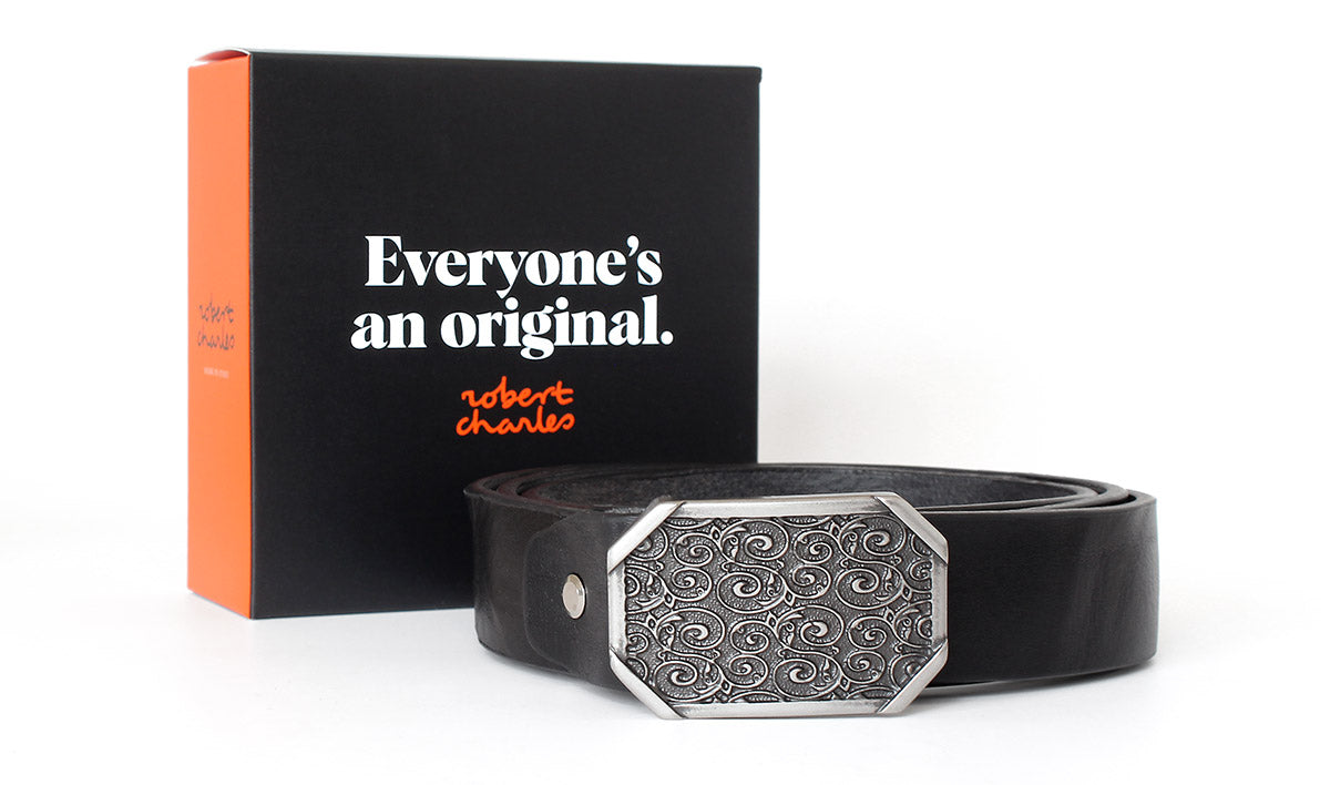 Premium solid hide Italian leather belt with western-style buckle, displayed with Robert Charles gift box 