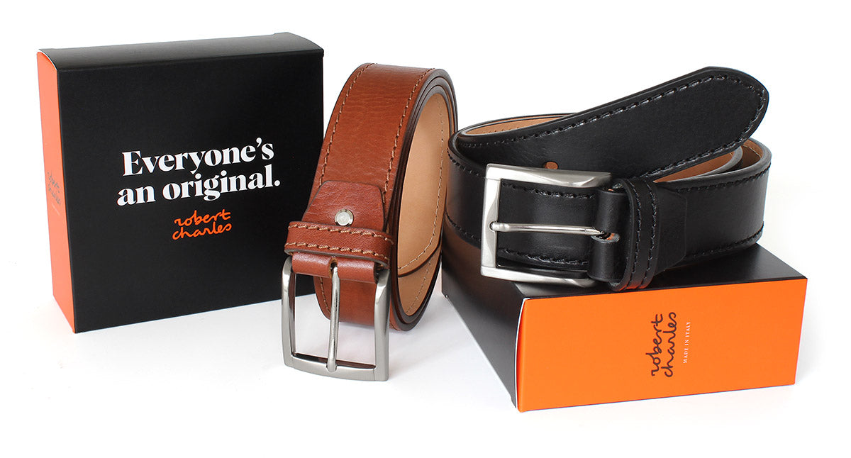 Handmade Italian leather jeans belts with classic solid brass buckle, displayed with Robert Charles gift box 