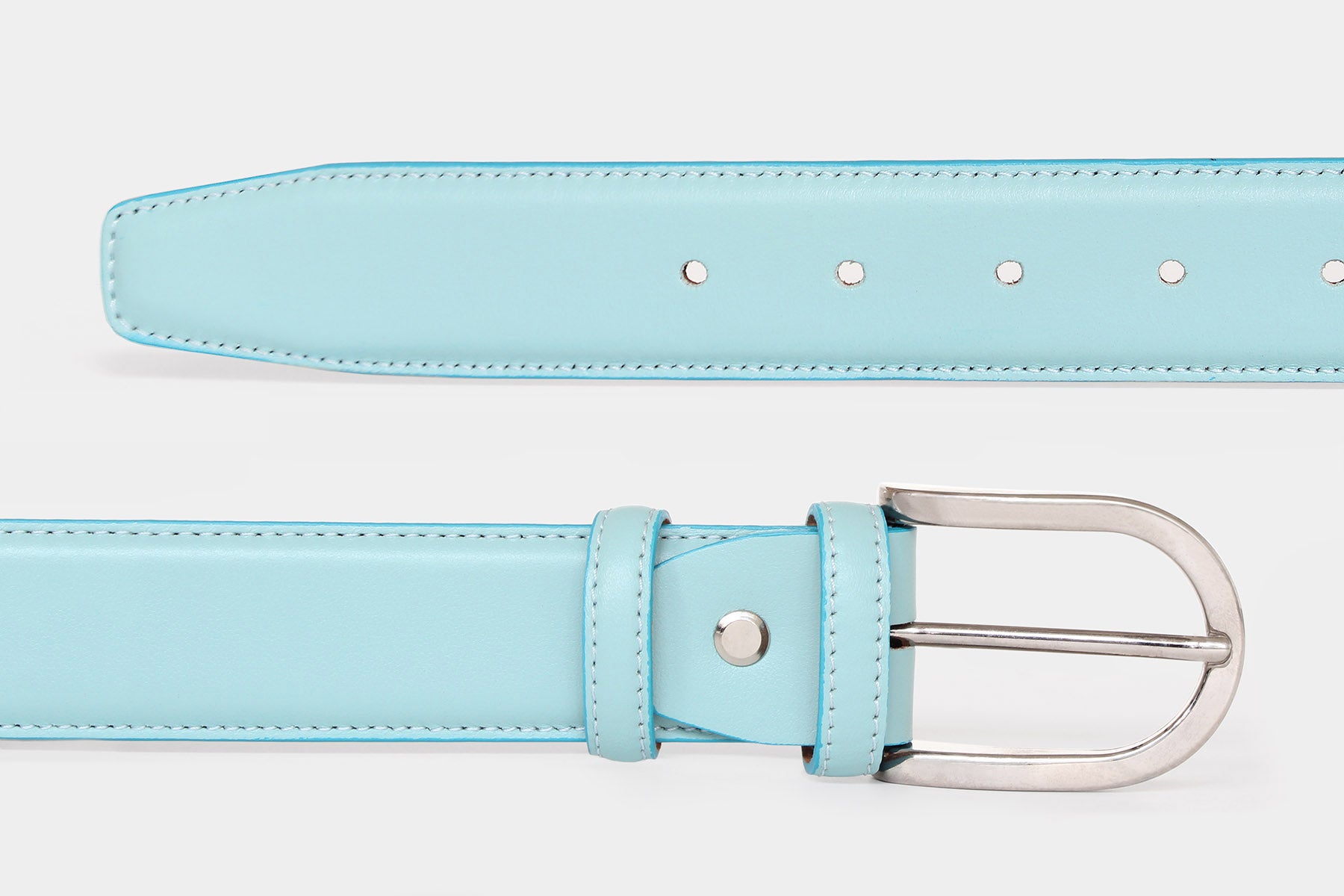 Close-up of women's ice blue soft Italian calfskin leather belt with a polished silver buckle. Made in Italy.