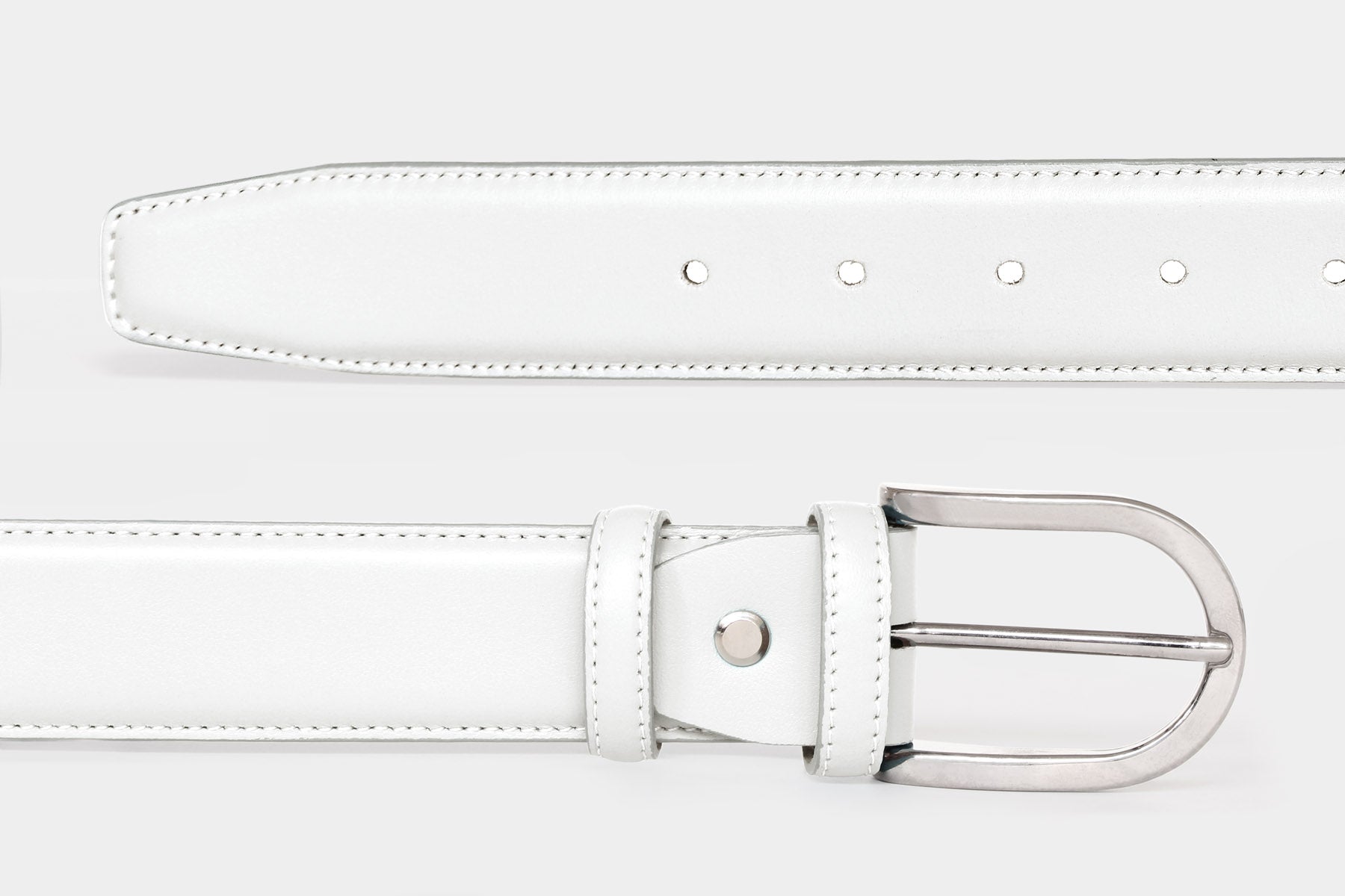 Close-up of women's white soft Italian calfskin leather belt with a polished silver buckle. Made in Italy.