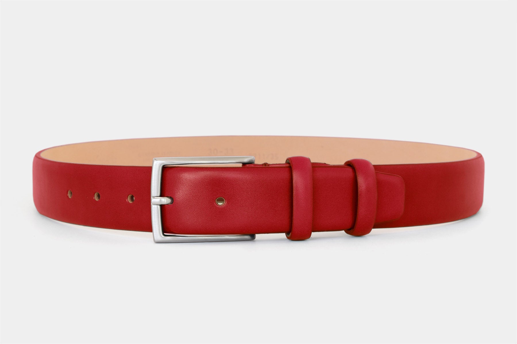 Men’s red smooth genuine Italian leather belt with classic solid brass buckle and feather edge finish. 