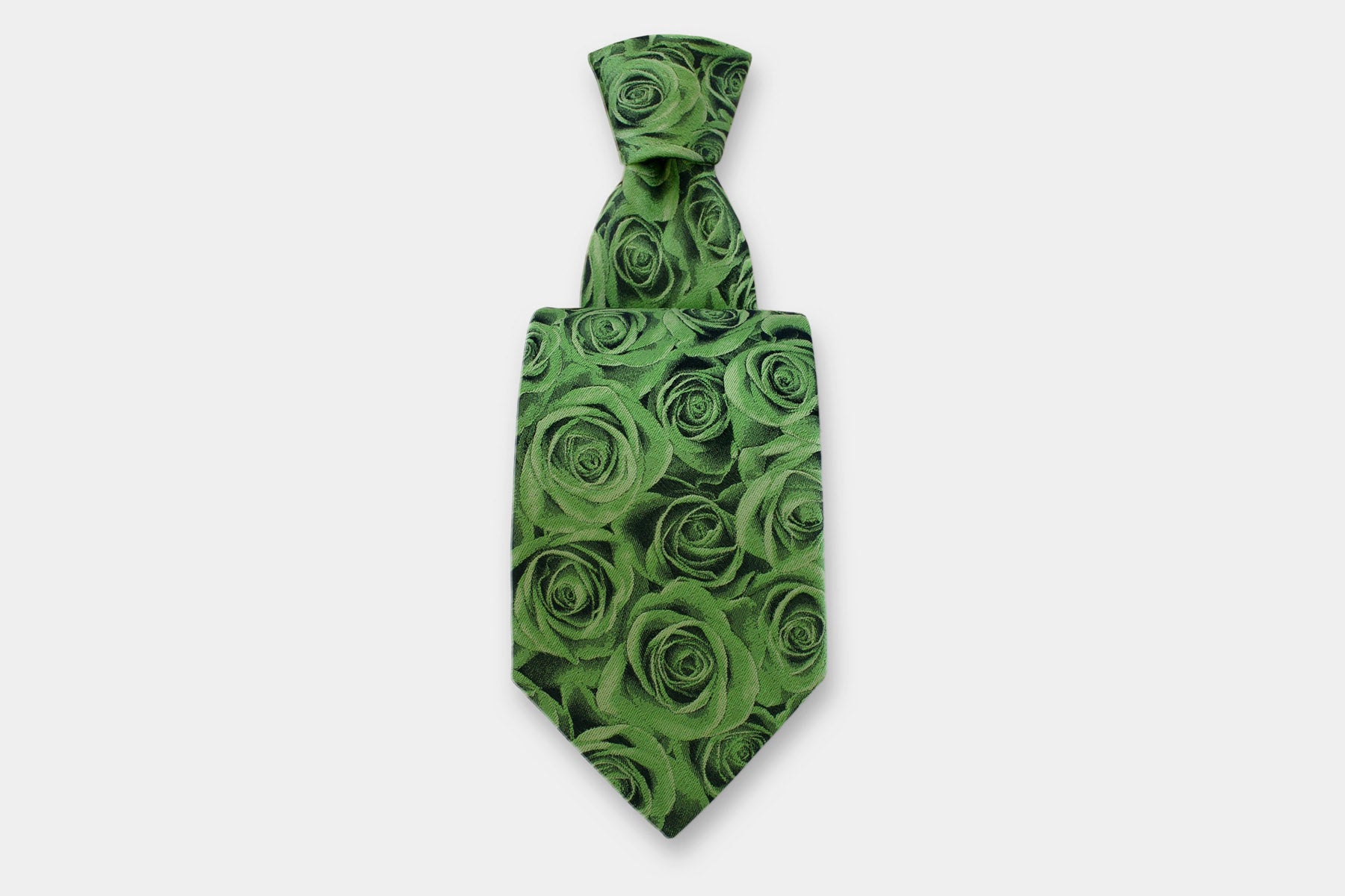 Robert Charles silk tie with a rose design in green. Handmade in Italy, presented with a classic knot.