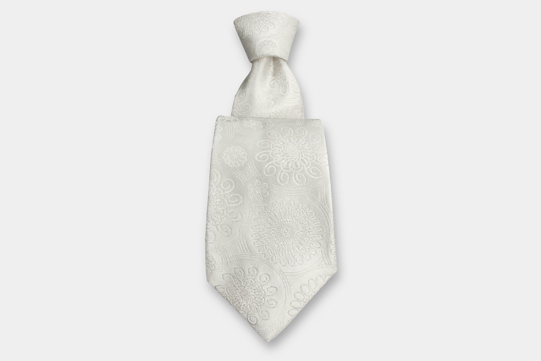 Robert Charles silk tie with an intricate floral weave in soft ivory - perfect for weddings. Handmade in Italy.